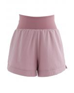Shorts de gimnasia con cintura cruzada en rosa polvoriento